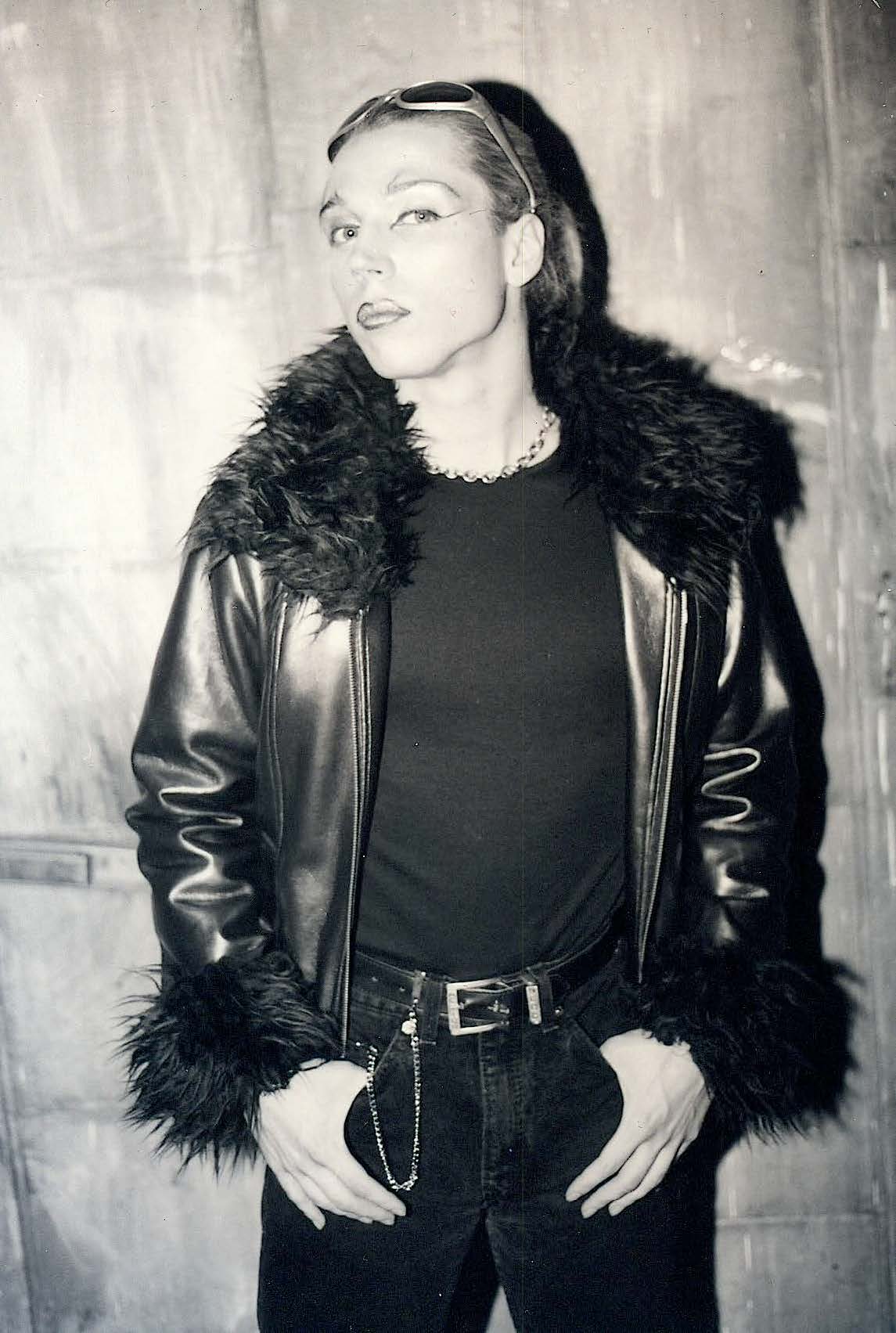 Woman in fur-collared leather jacket