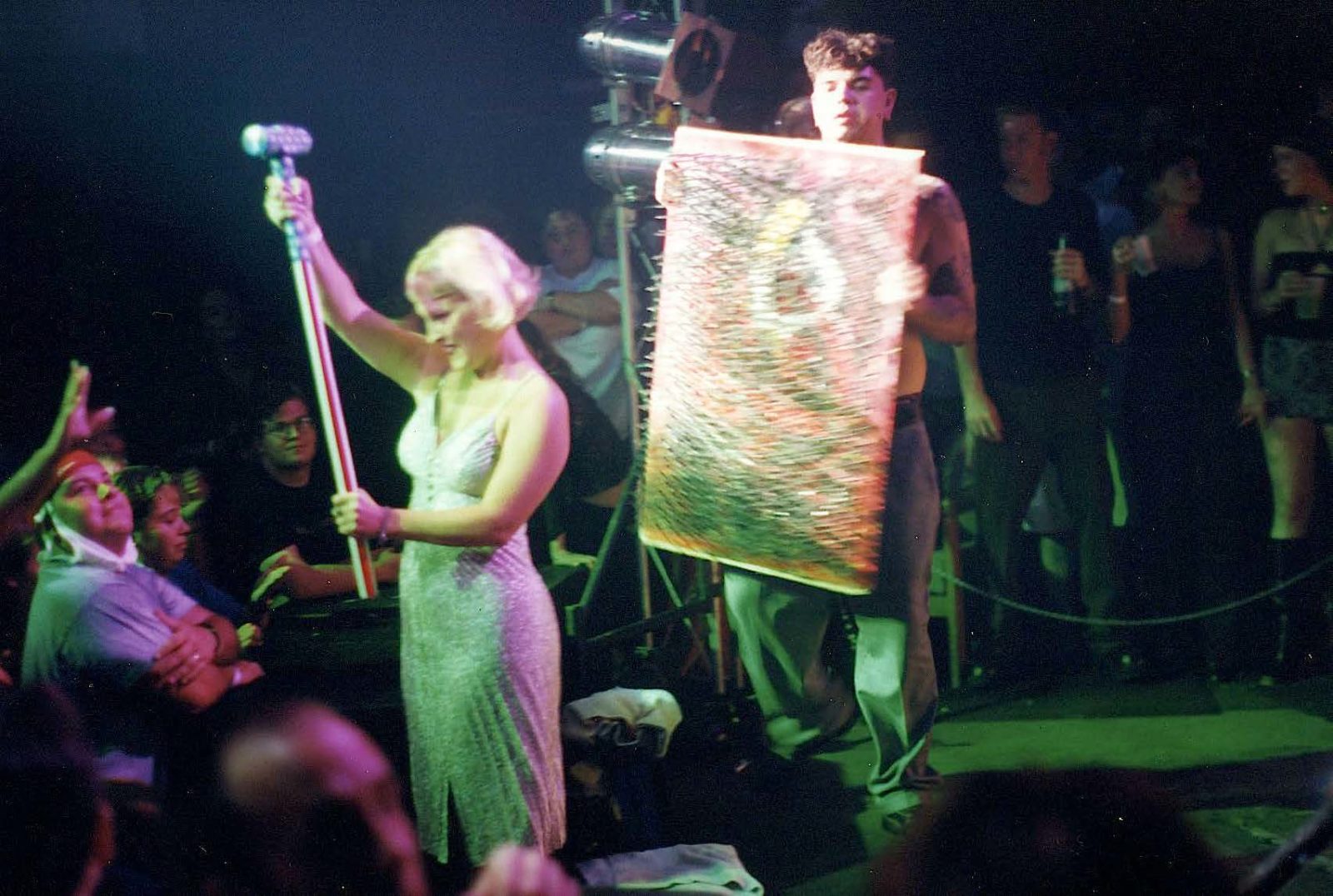 Performer with microphone and glittering cloth